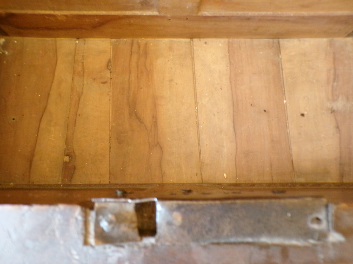 Seventeenth Century oak coffer with tulip and leafage carving surrounding two geometric mouldedpanels.