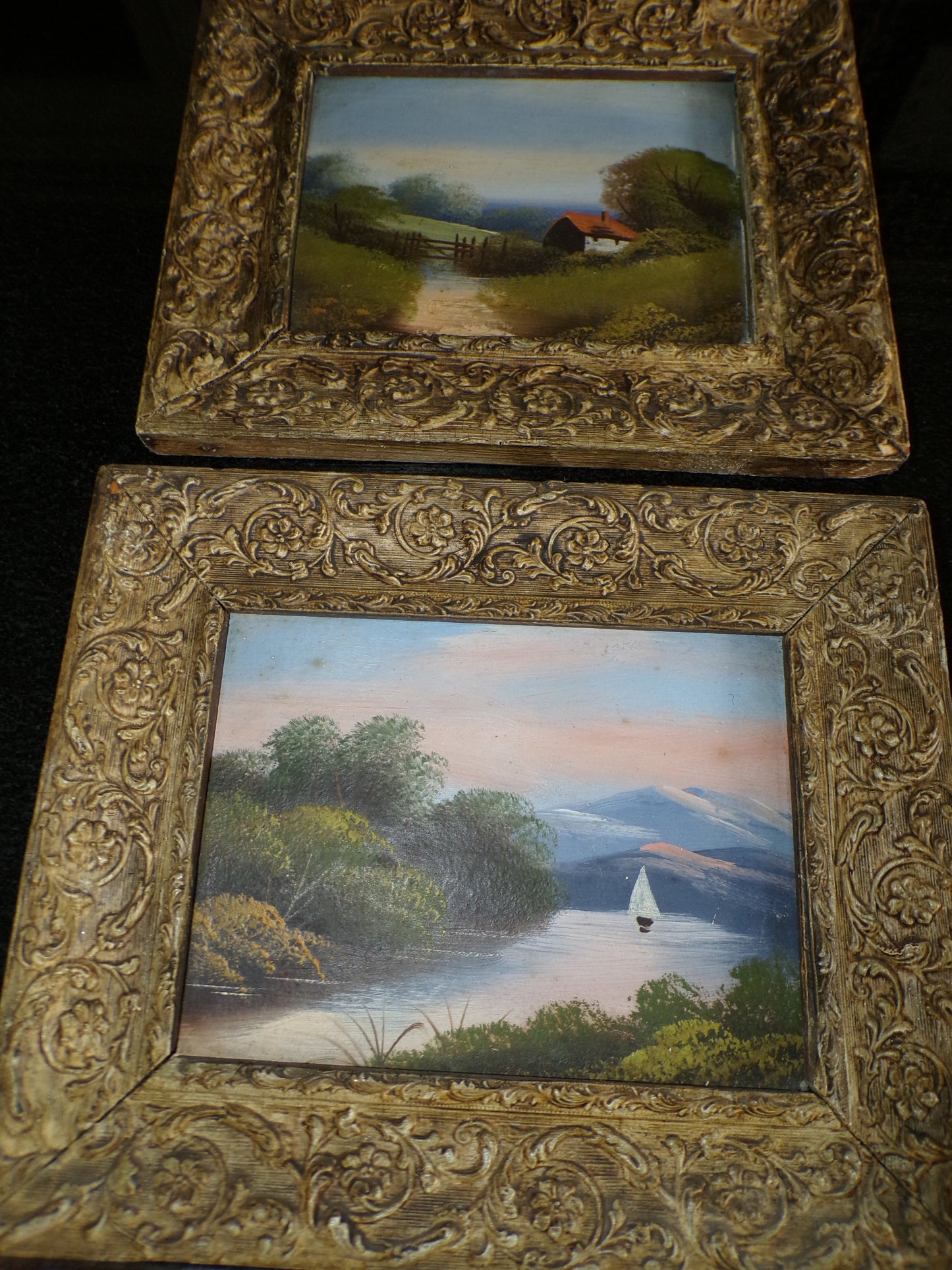 A pair of Edwardian oil painted scenes on board with gilt frames