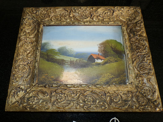 A pair of Edwardian oil painted scenes on board with gilt frames