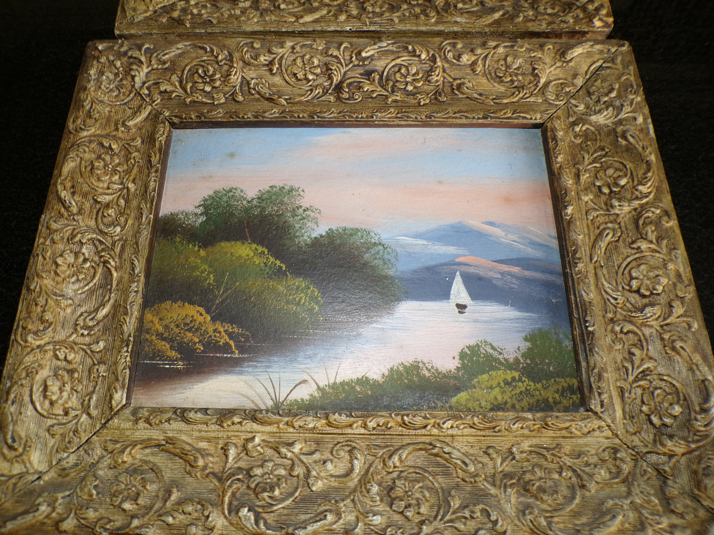 A pair of Edwardian oil painted scenes on board with gilt frames