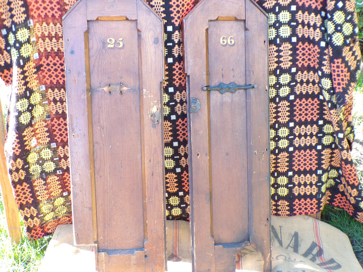 Pitch pine church pew ends with painted numbers